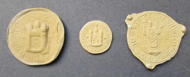 Casts taken from seals of Kinghorn Burgh and held in the Office of the Lord Lyon in Edinburgh. L – R: cast from an original 16th century wax seal; cast from the obverse of a seal held in the Town Clerks Office in 1891; cast from the reverse of a seal held in the Town Clerks Office in 1891. Casts taken from seals of Kinghorn Burgh and held in the Office of the Lord Lyon in Edinburgh. L – R: cast from an original 16th century wax seal; cast from the obverse of a seal held in the Town Clerks Office in 1891; cast from the reverse of a seal held in the Town Clerks Office in 1891.